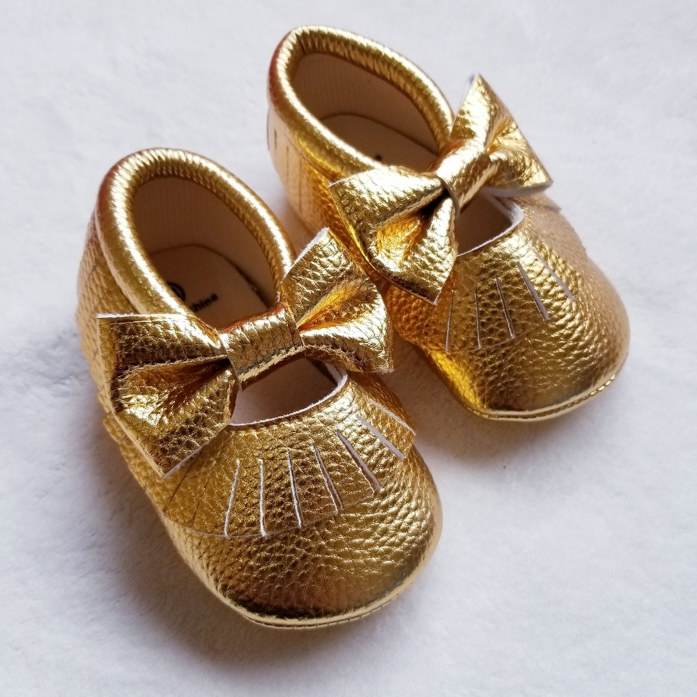 Cute gold baby girl moccasins